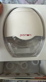 PROMOM NEO wearable breast pump with hands-free design, compact milk collection cups, adjustable suction, and portable pumping support for breastfeeding mothers.