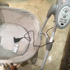 Discover the BABYHUG Automatic Cradle for Baby - NUBF027, featuring automatic rocking, multiple speed settings, a timer, and calming music for a soothing and secure sleeping environment.