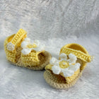 Crochet baby booties with flower
