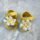 Crochet baby booties with flower