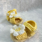 Crochet baby booties with flower