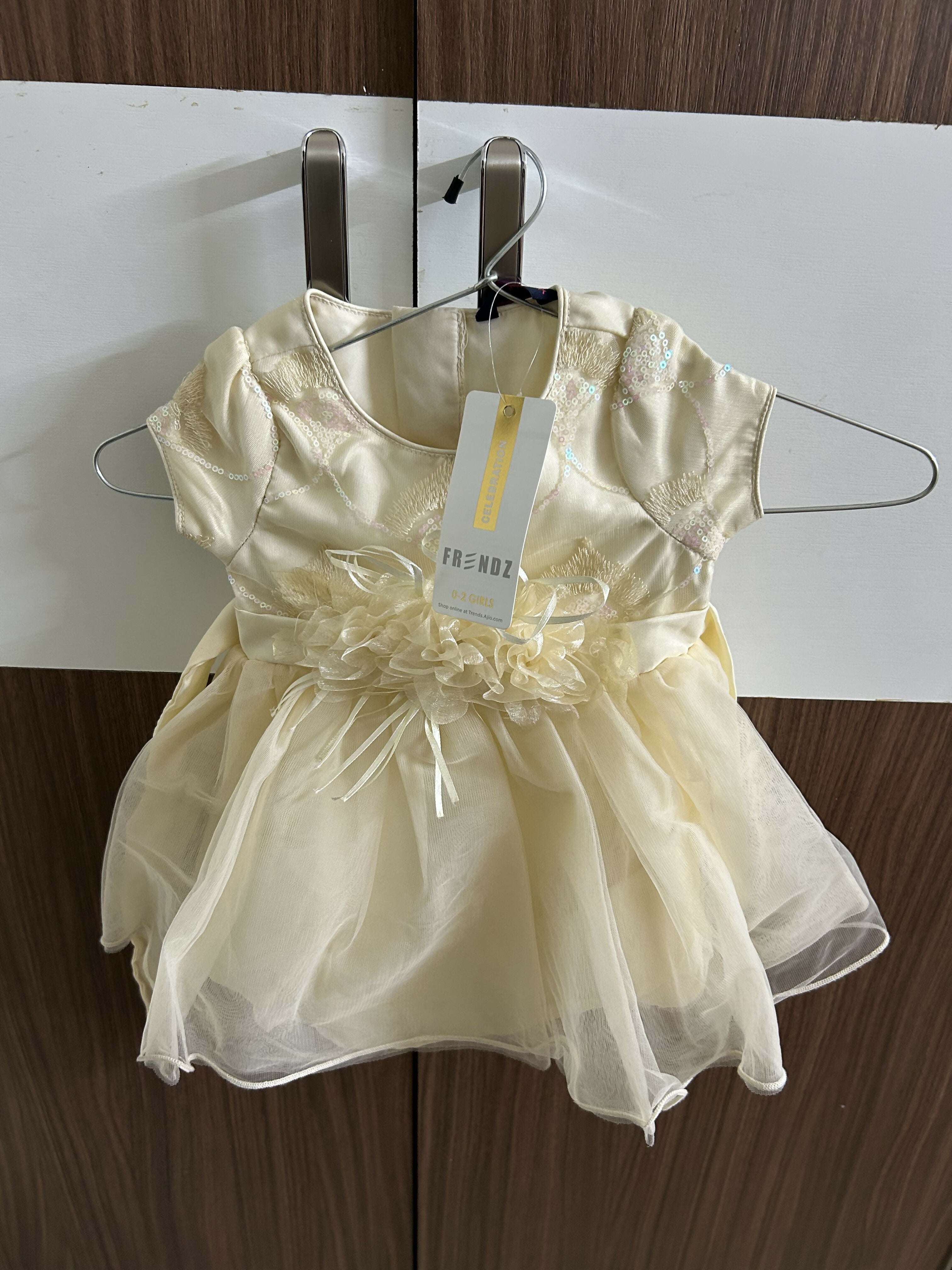 Yellow dress with a tag 