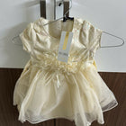 Yellow dress with a tag 