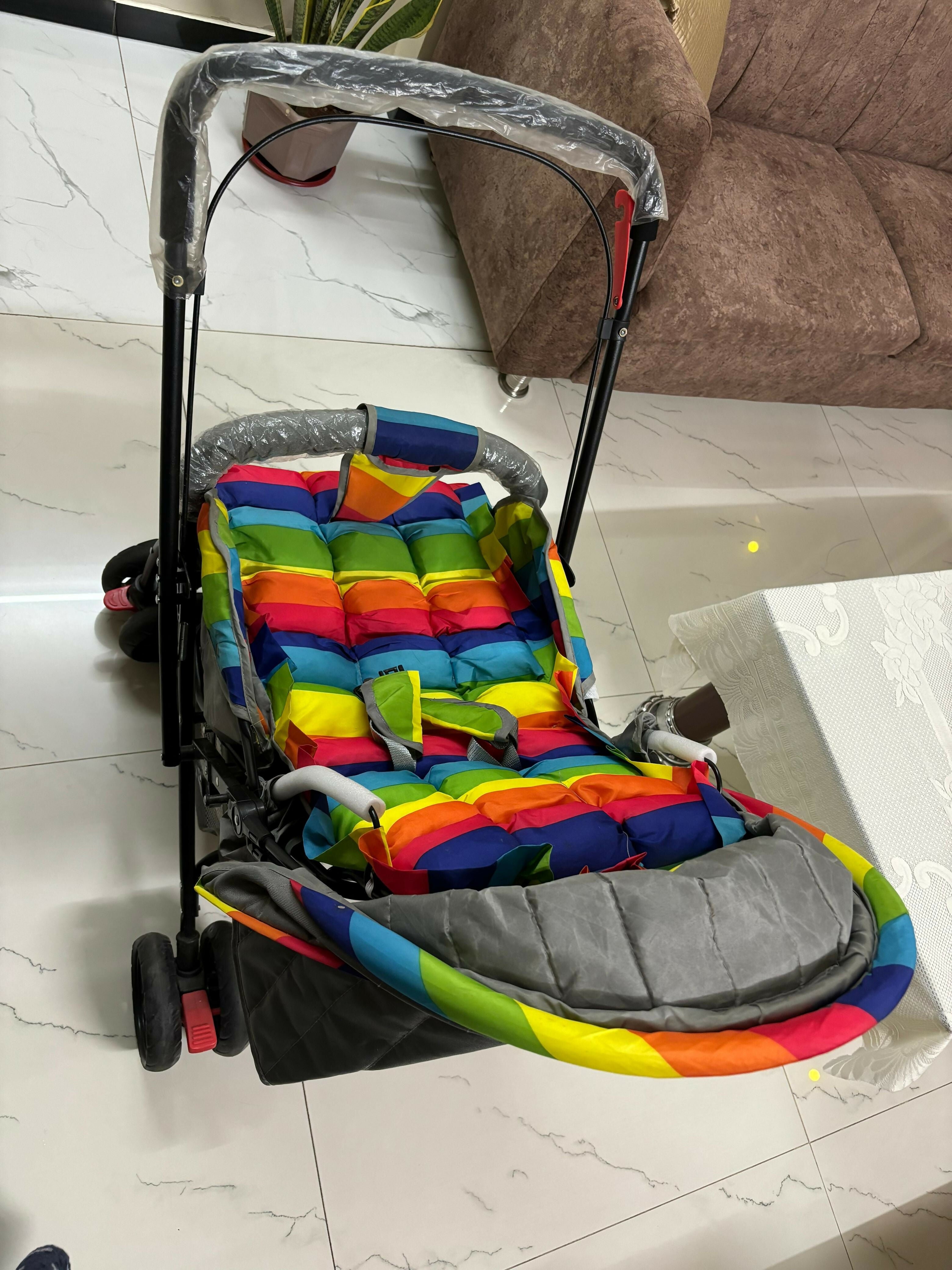 BABYHUG Cosy Cosmo Stroller/Pram with Reversible Handle offers comfort and convenience, featuring a back pocket and smooth maneuverability for your baby’s outings.

