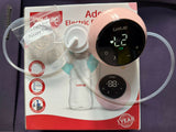 Electric breast pump with clear tubing on a purple background