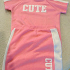 Shop now for the Pink T-shirt with Cap and Short Skirt set, offering comfort, style, and adorable charm for your baby’s everyday wear!