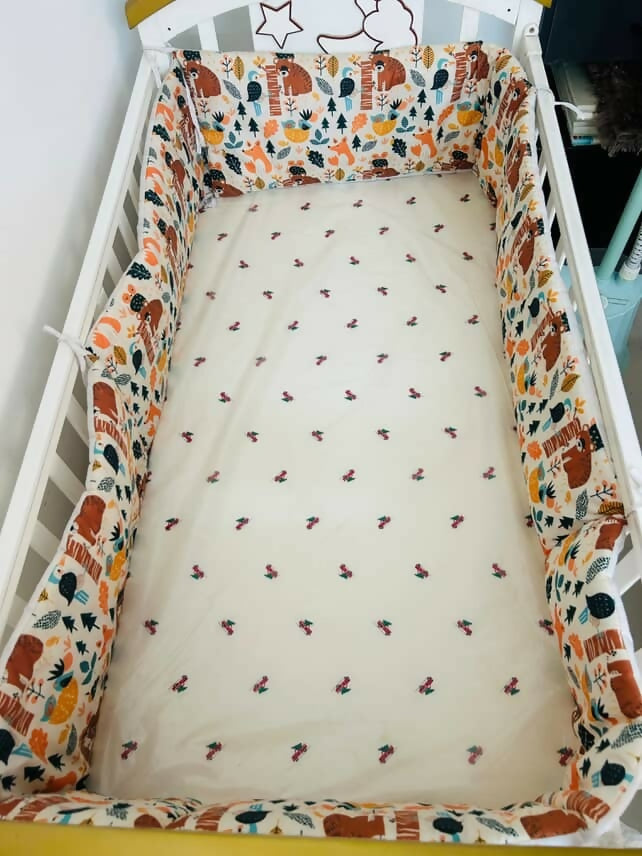 Shop Huny Huny Convertible Baby Cot – Wooden crib with storage, teething rails, wheels, and adjustable height.