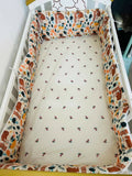 Shop Huny Huny Convertible Baby Cot – Wooden crib with storage, teething rails, wheels, and adjustable height.