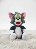 Plush toy of a cartoon cat with a gray body, white paws, and pink ears 