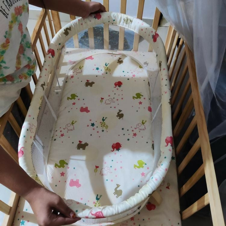 Ensure your baby's comfort and safety with the BABYHUG Kelly Wooden Crib/Cot – featuring a detachable bassinet, mosquito net, and smooth-rolling casters for easy mobility and convenience.