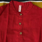 Red jacket with a brand label on a yellow background