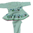 Children's outfit with a green top and pants featuring train designs on a white background