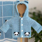Baby blanket, sweater, beanie, and booties set for warmth and comfort, crafted from baby-safe materials, perfect for everyday use or gifting.