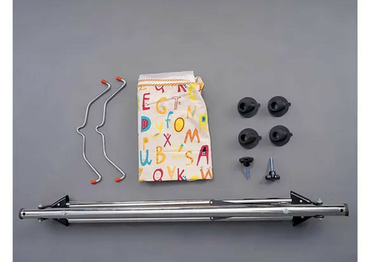 Collection of bike components including a metal frame, hangers, and small parts on a gray background.