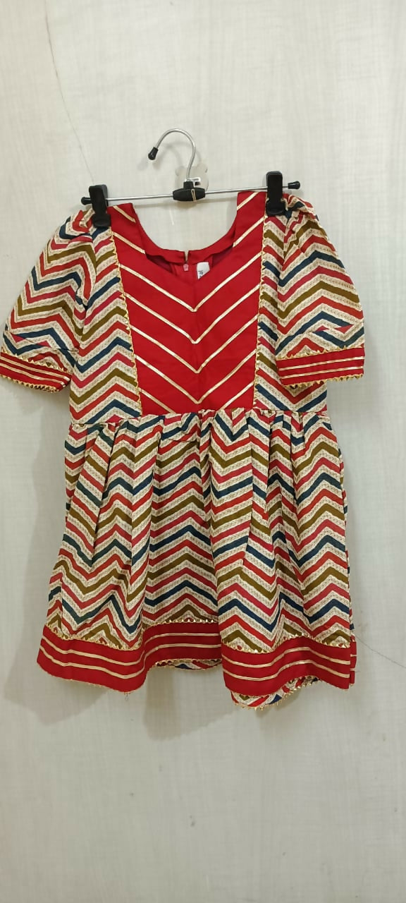 Elevate your baby girl's style with the captivating combination of red and skin color - a perfect blend of vibrancy and warmth for her adorable wardrobe