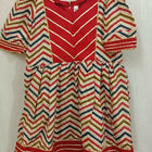 Elevate your baby girl's style with the captivating combination of red and skin color - a perfect blend of vibrancy and warmth for her adorable wardrobe