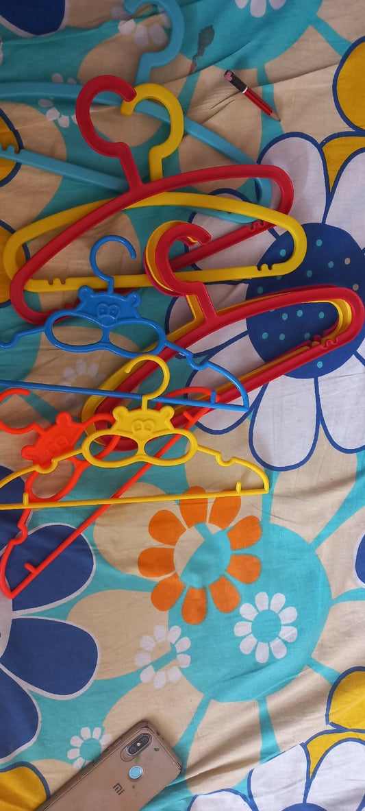 Add a splash of fun and organization to your child's closet with these colorful small hangers, specially designed to hold baby and toddler outfits perfectly. 