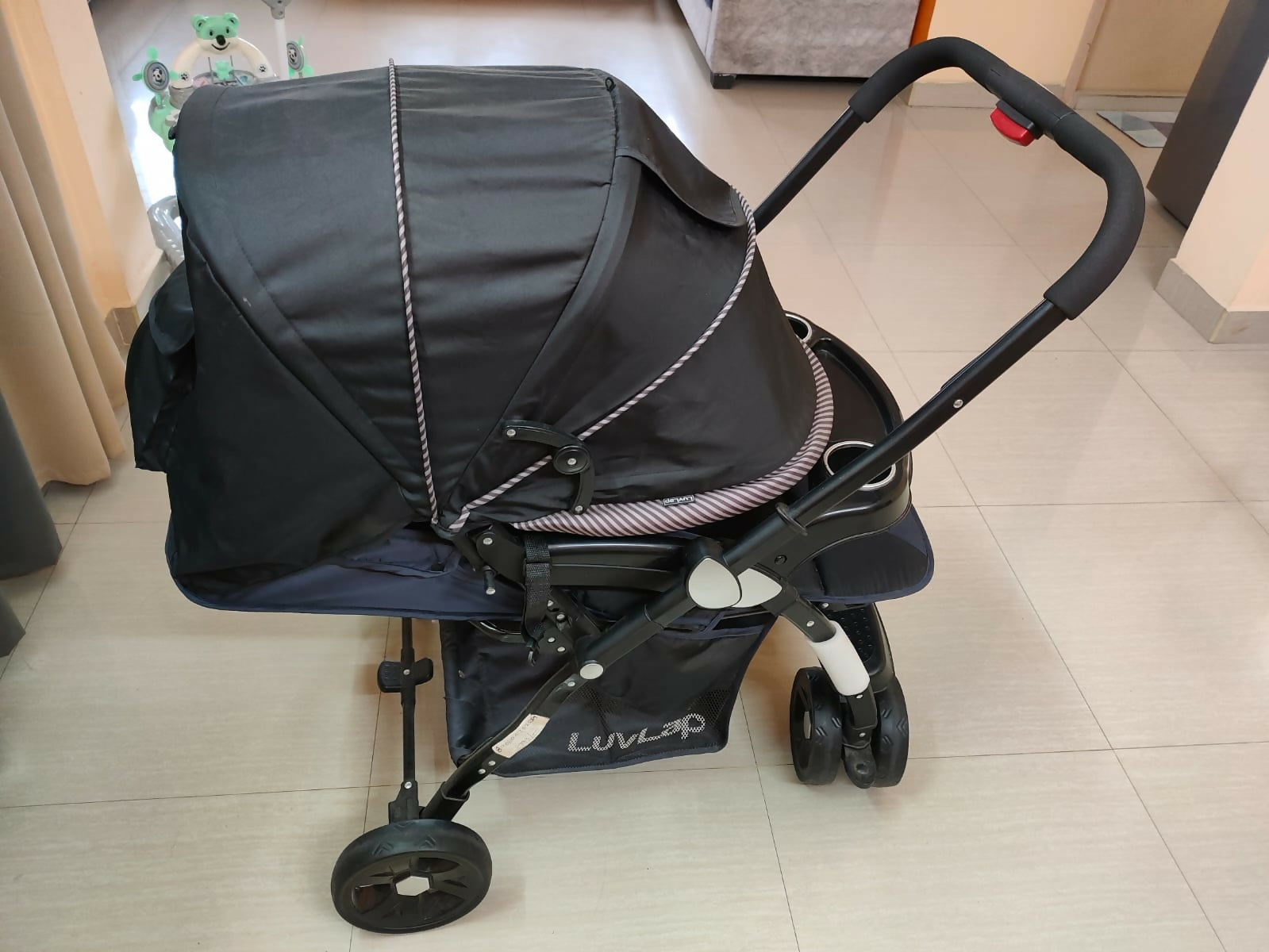 Buy LuvLap Baby Stroller – Safe, foldable pram with reclining seat, safety harness, and storage basket for newborns and toddlers.

