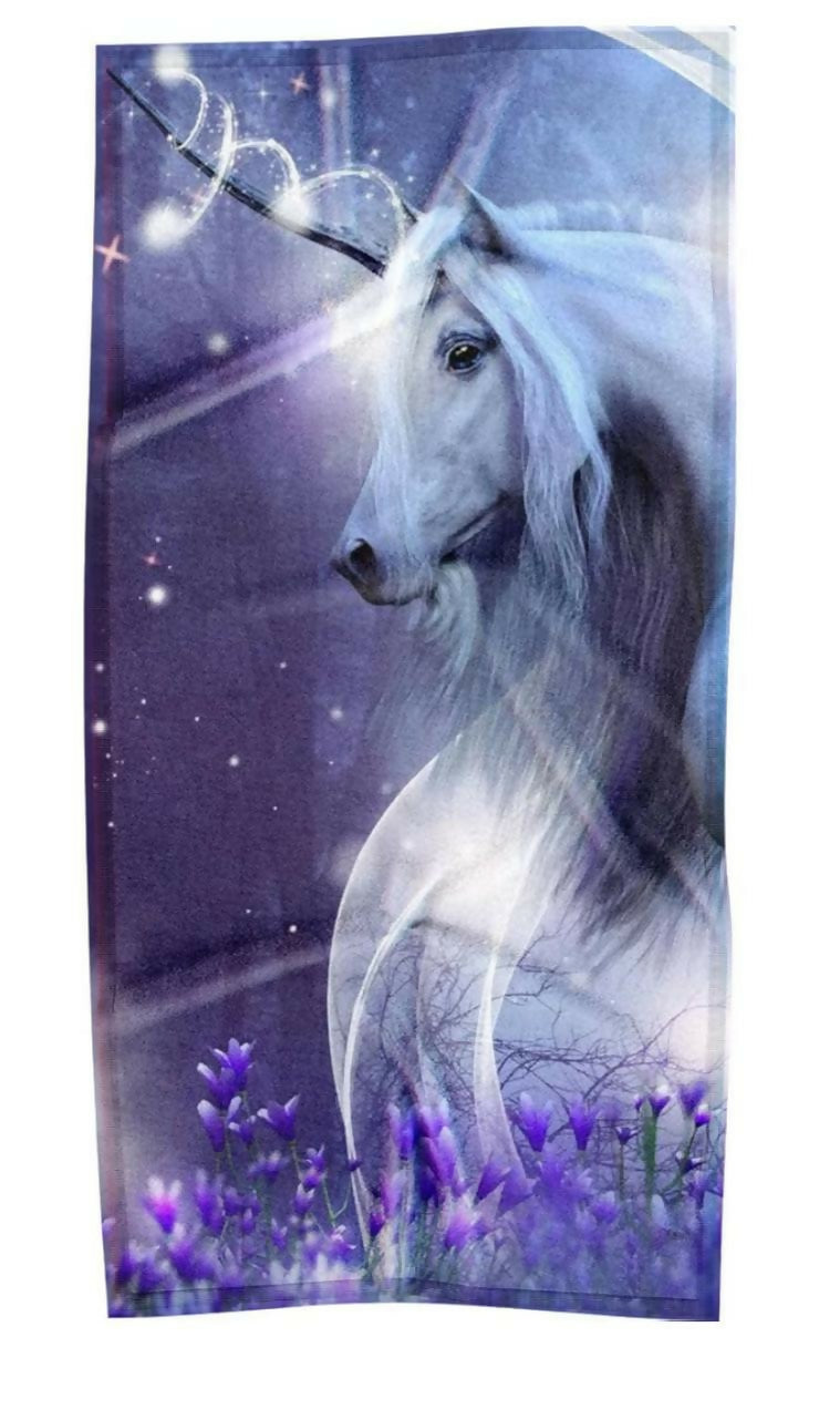 Towel with a unicorn design on a purple background
