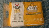 Pack of Mylo Baby Diaper Pants on a textured surface