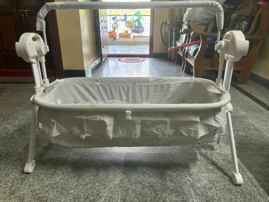Ensure your baby's comfort and safety with the STAR AND DAISY Cot/Crib featuring Adjustable Height, Mosquito Net, and Electrical Swing for peaceful sleep and play.