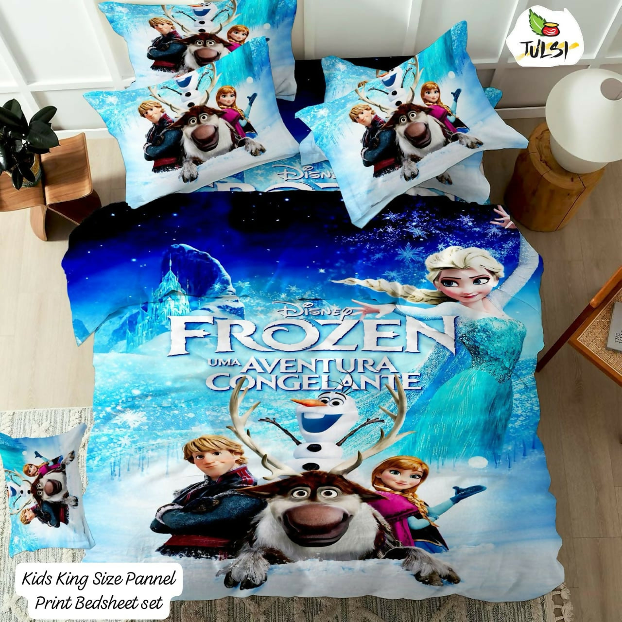 Frozen-themed bedding set with characters on a bed