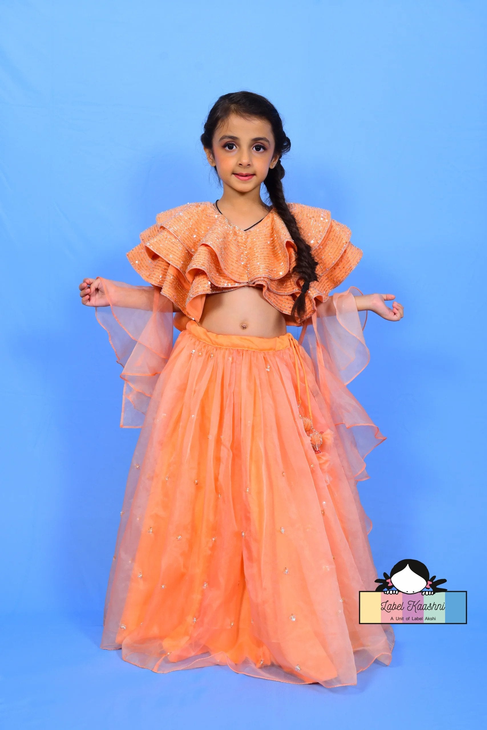 Glitter (lehenga) PEACH COLOUR STYLISH & ELEGANT LEHENGA FOR KIDS PARTY WEAR - PyaraBabyDress your child in elegance and style with the Glitter Lehenga in peach – a stunning party wear outfit perfect for festive celebrations and special occasions.