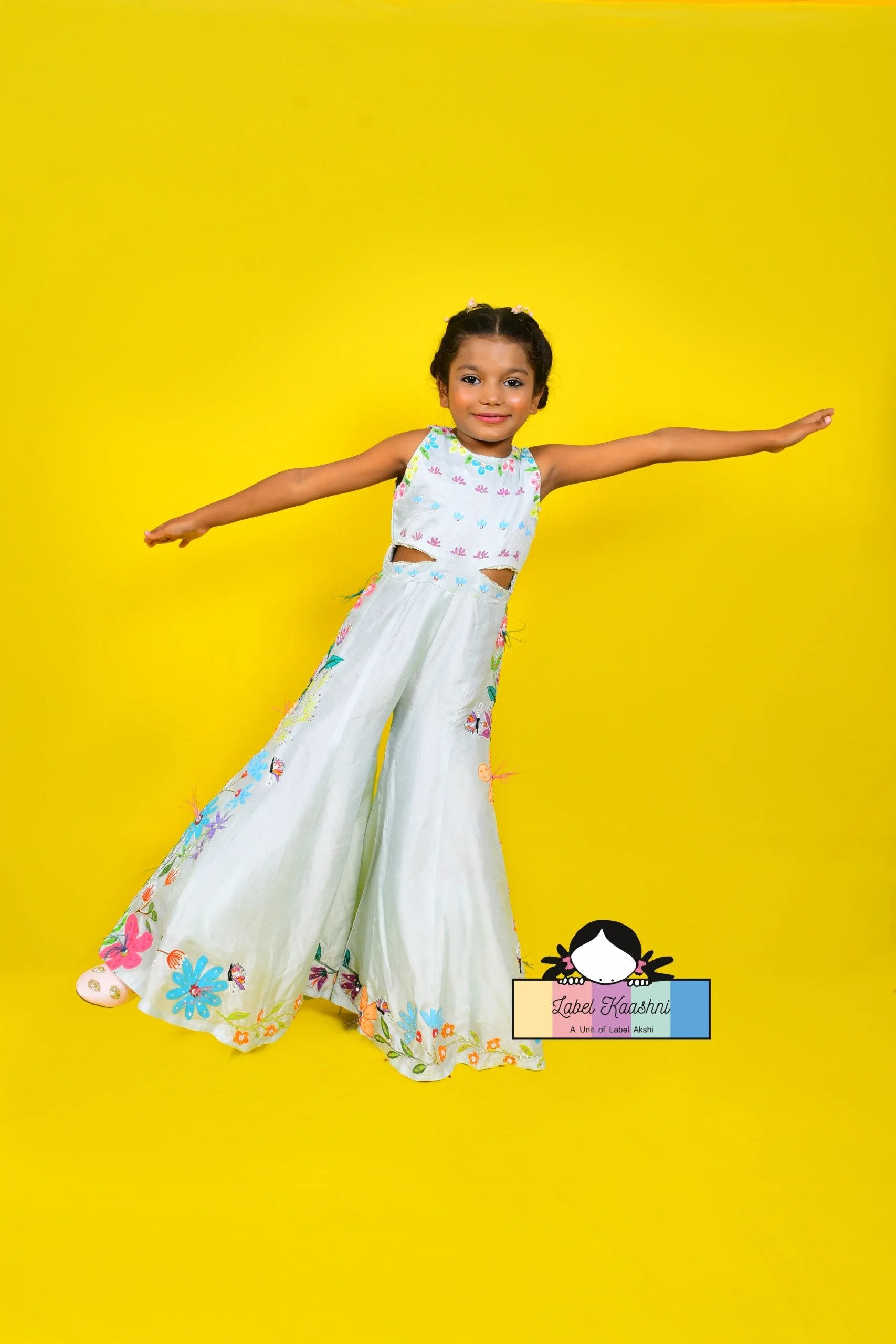 Elevate your child's fashion with the Blossom Jumpsuit – a floral delight that brings elegance and beauty to kids' wardrobes, perfect for any occasion.