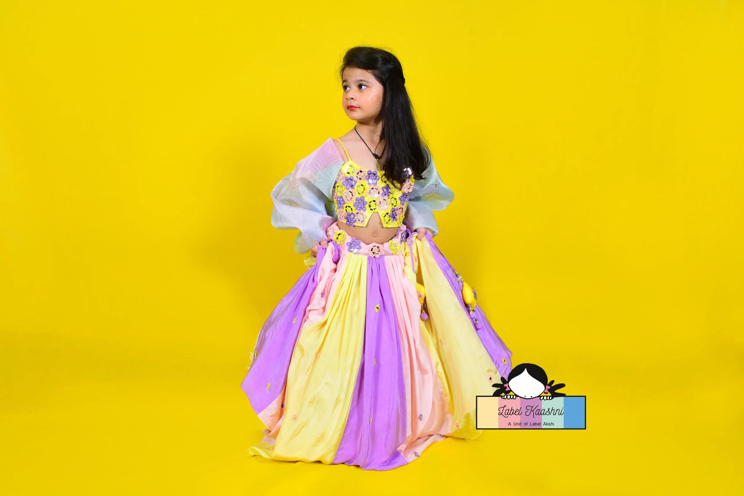 Bring joy and vibrancy to your child's wardrobe with the Candy Land Lehenga – a multicolored ethnic ensemble perfect for festive celebrations and special occasions, designed to make your little one shine bright.