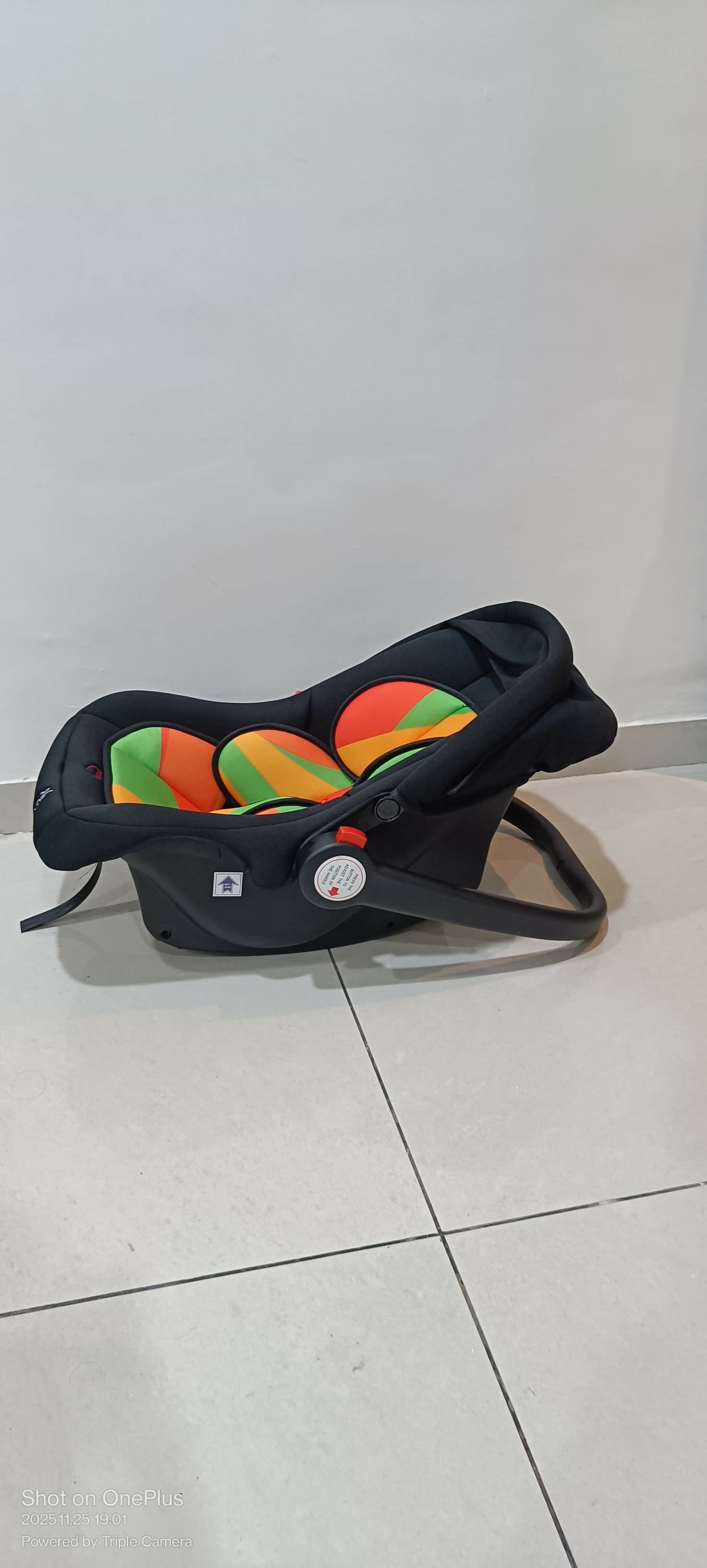 Black car seat with colorful design 