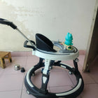 StarAndDaisy 3-in-1 baby walker with parent handle and musical tray, almost new condition