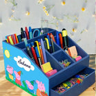 Blue children's desk organizer with stationery items 