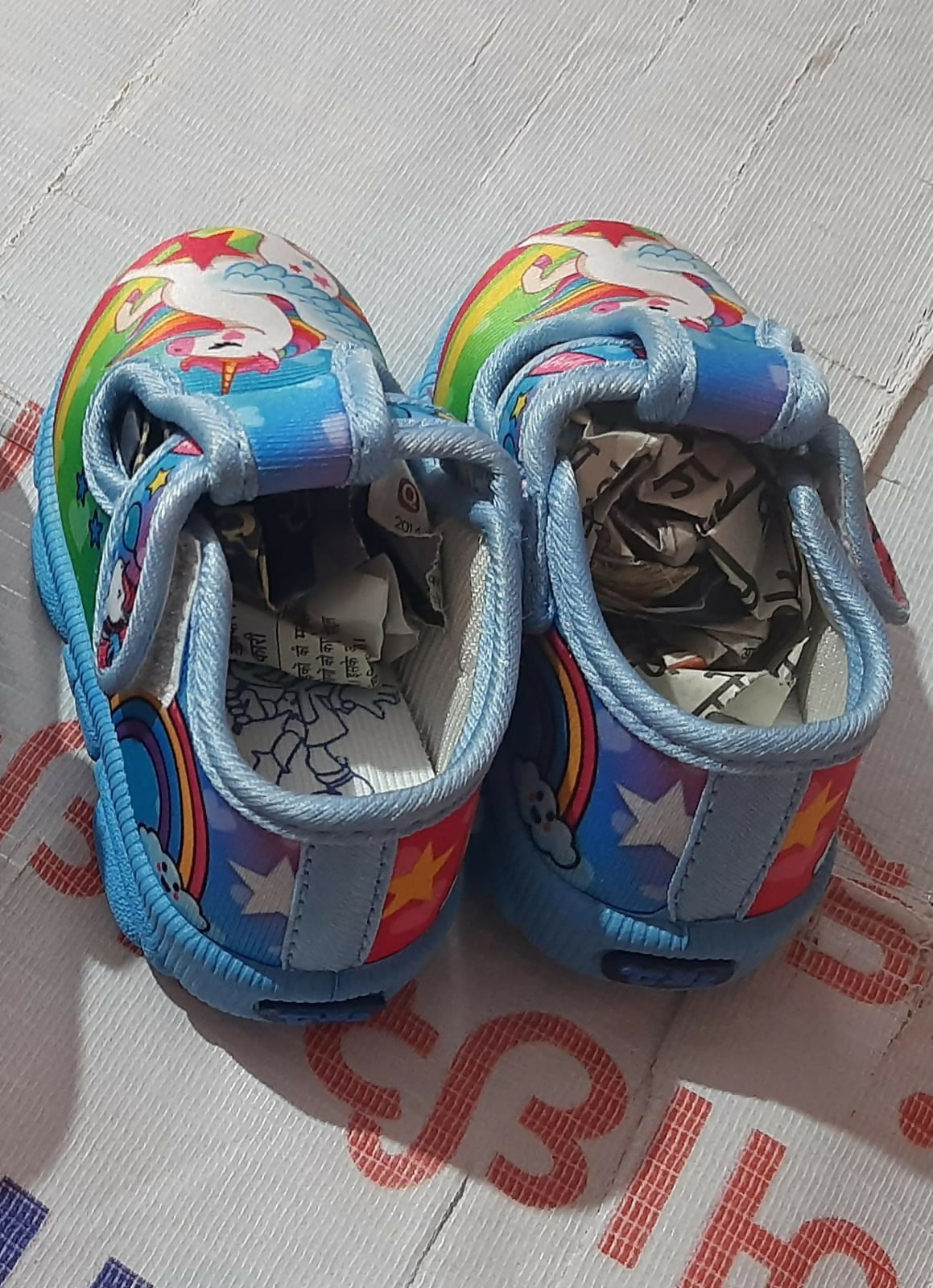 Colorful children's shoes with star and rainbow design
