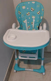 Children's high chair with a blue seat and white tray 