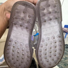 Pair of gray slippers with textured sole 