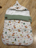 Haus & Kinder 3-in-1 Baby Sleeping Bag & Carry Nest in Whimsical Woodland with soft cotton fabric, portable carry nest, cozy bedding, secure wrap design, and skin-friendly materials for newborns aged 0–6 months.