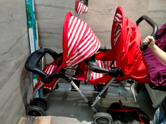 Make outings with twins effortless with the BABYHUG Twinster Easy Foldable Twin Stroller/Pram in vibrant Red, featuring adjustable legrests for customized comfort.