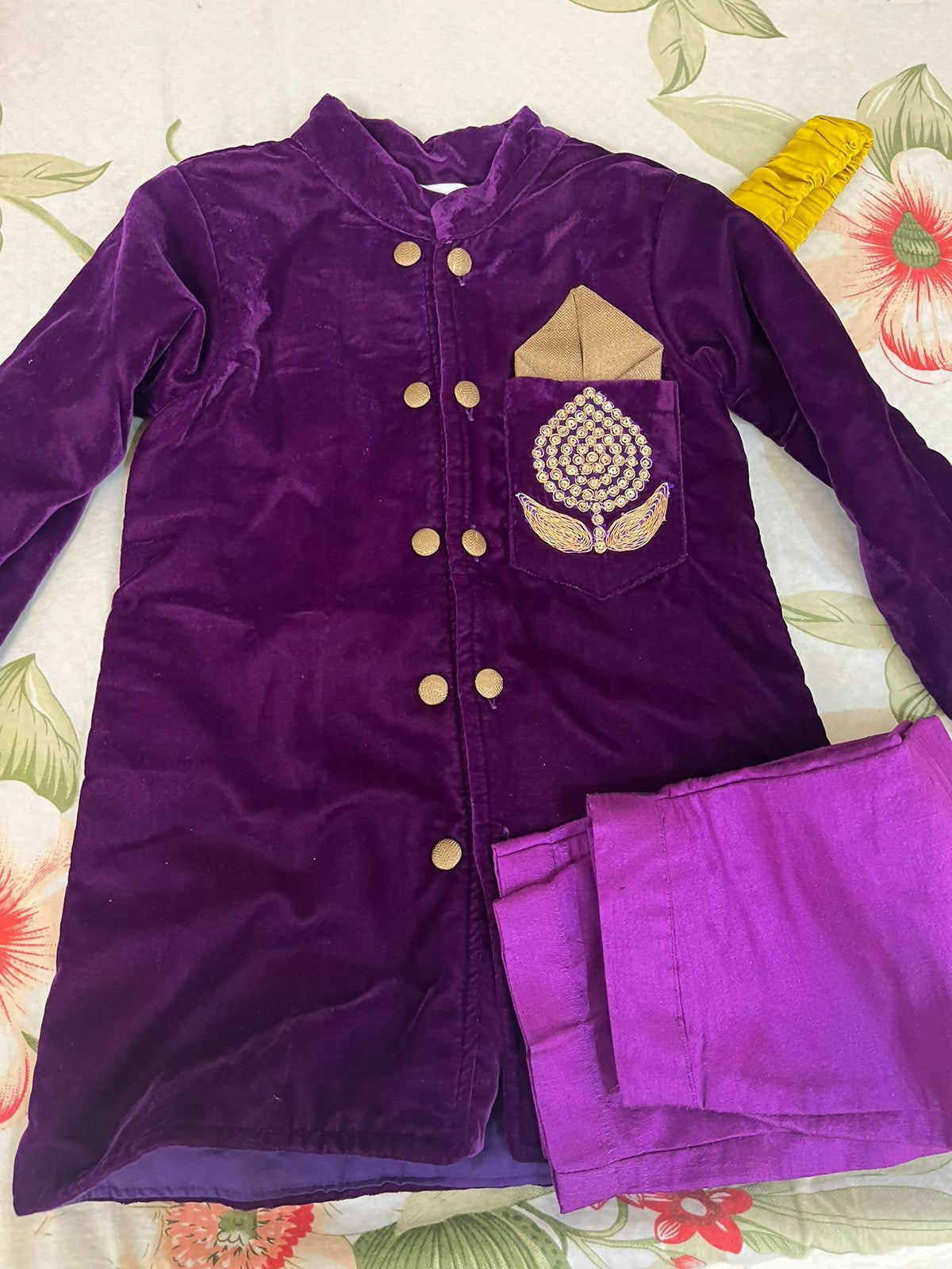 Elegant purple baby sherwani with intricate detailing, soft fabric, and comfortable fit, perfect for festive occasions and celebrations.