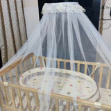 Ensure your baby's comfort and safety with the BABYHUG Kelly Wooden Crib/Cot – featuring a detachable bassinet, mosquito net, and smooth-rolling casters for easy mobility and convenience.