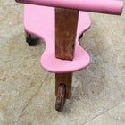 Pink wooden kids balance bike with handlebar and single front wheel, pink, brown
