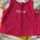 Pink sleeveless top with 'Mykraft' branding on a colorful geometric patterned background.