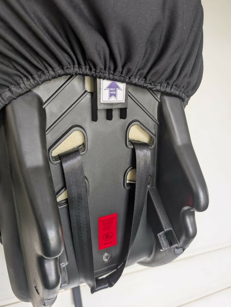 Black car seat cover on a car seat 