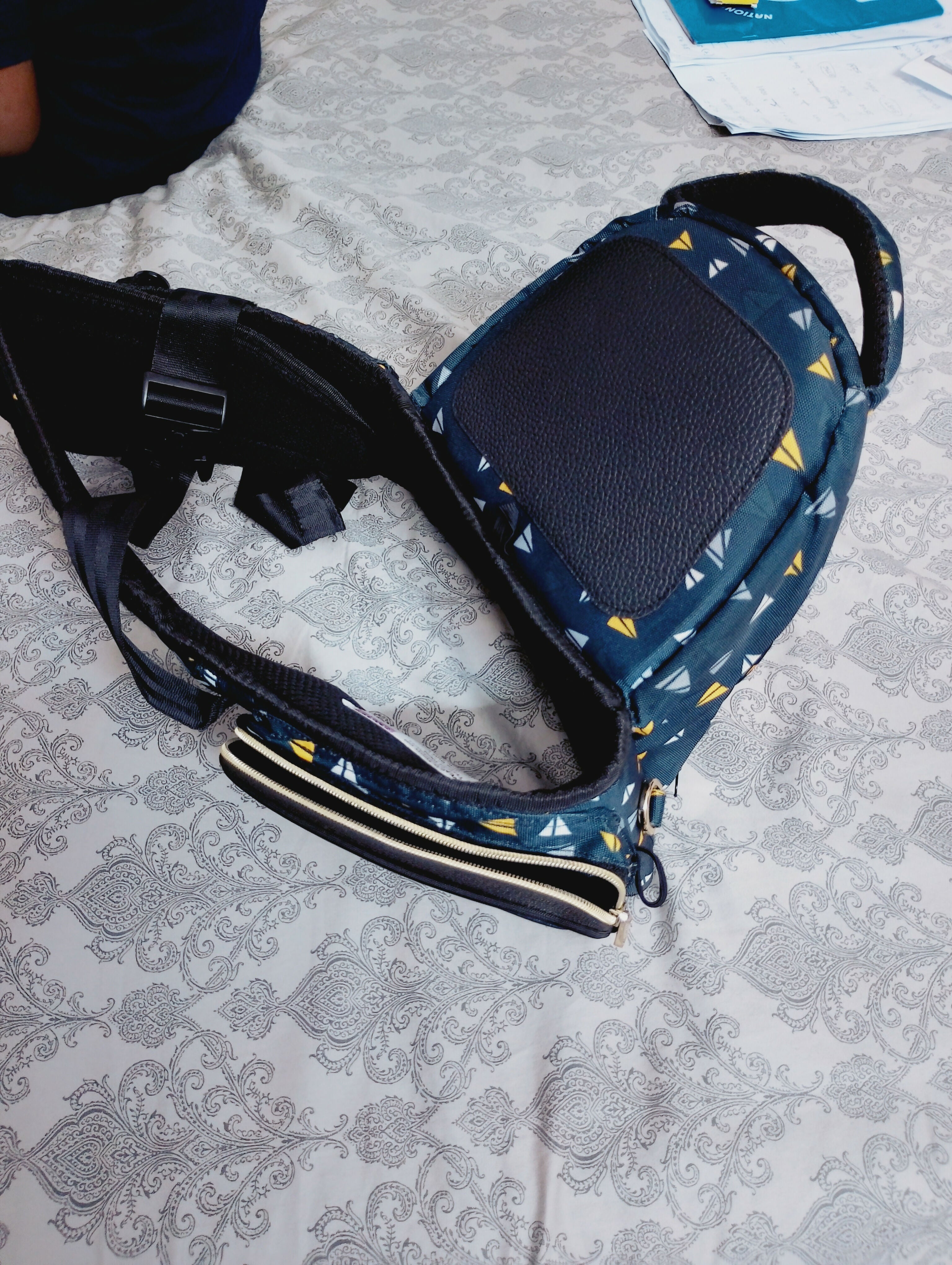 Pet carrier with blue pattern on a textured surface