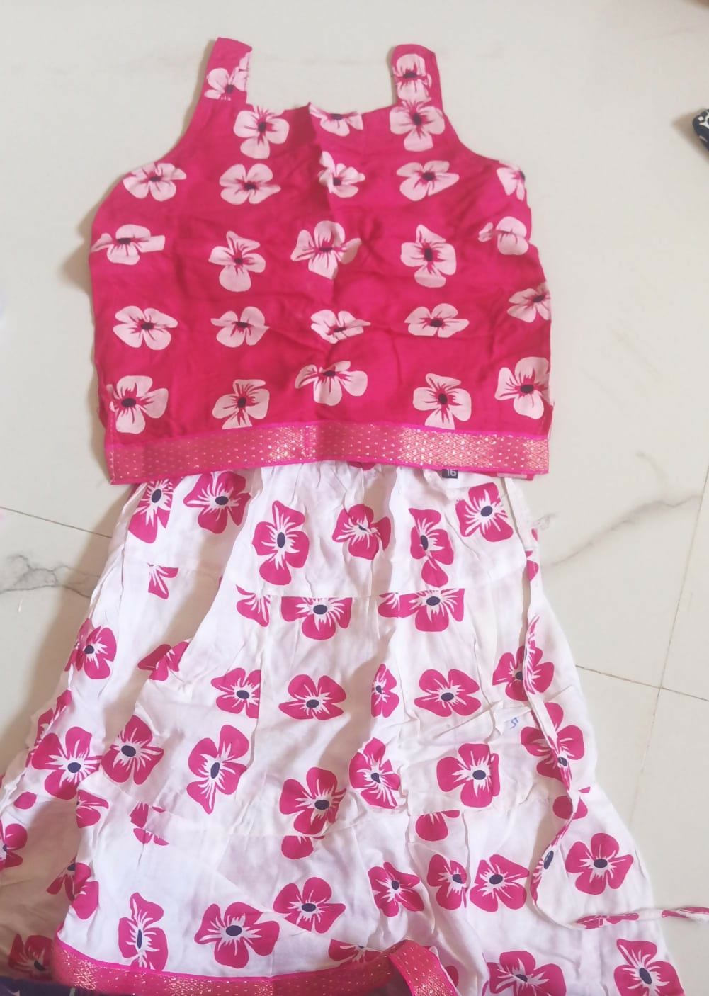 Pink Frock/Dress for Baby Girl, featuring soft fabric and delicate detailing for a charming and elegant look on any occasion.
