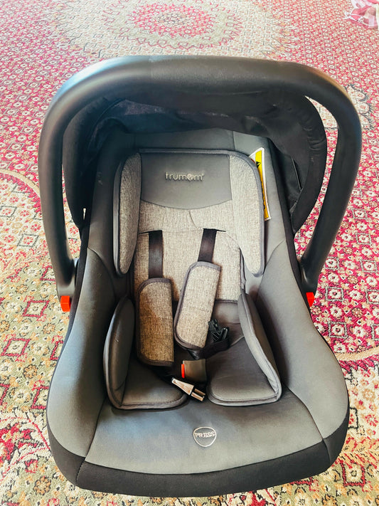 TRUMOM USA baby car seat, carry cot & rocker – safe, comfortable & versatile for infants 0–15 months.