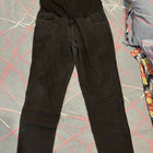 Black pants on a gray surface with red lines