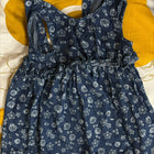 Navy blue fabric with white patterns on a yellow background