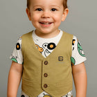 Child wearing a beige vest 