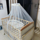 Ensure your baby's comfort and safety with the BABYHUG Kelly Wooden Crib/Cot – featuring a detachable bassinet, mosquito net, and smooth-rolling casters for easy mobility and convenience.