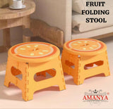 Two orange folding stools with fruit design